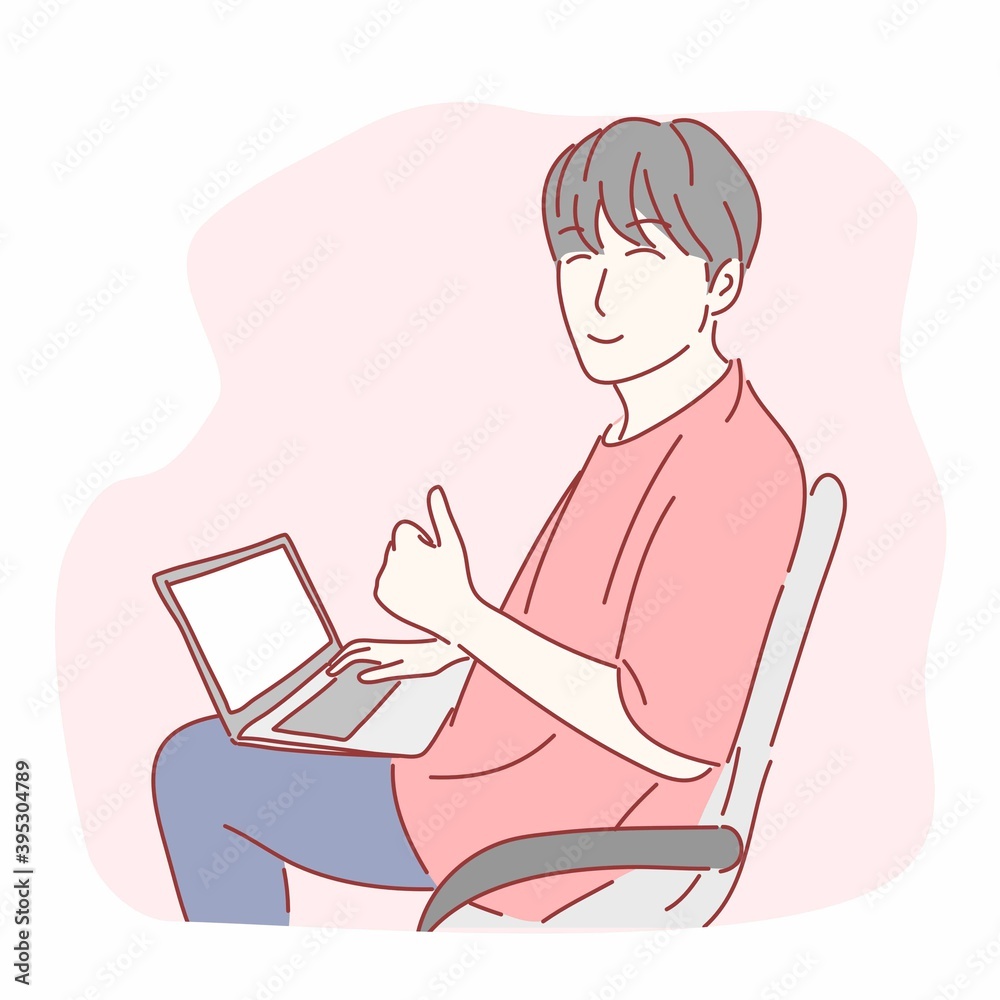 Happy man gesturing thumbs up in front of laptop computer. Happy man gesturing thumbs up in front of laptop computer.