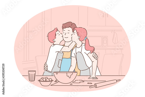 Family care, fatherhood, fathers day concept. Happy man father daddy parent sitting with children in kitchen and hugging kissing during cooking and baking together at home. Fathers day, dad 