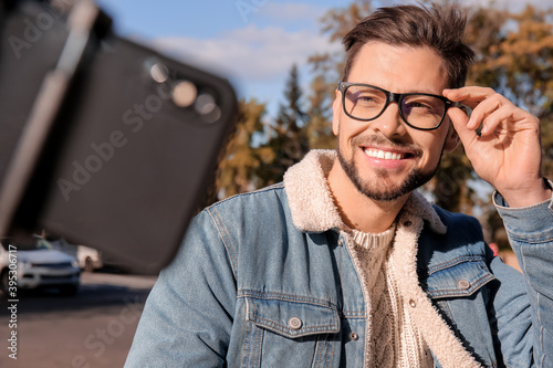 Handsome man taking selfie ...