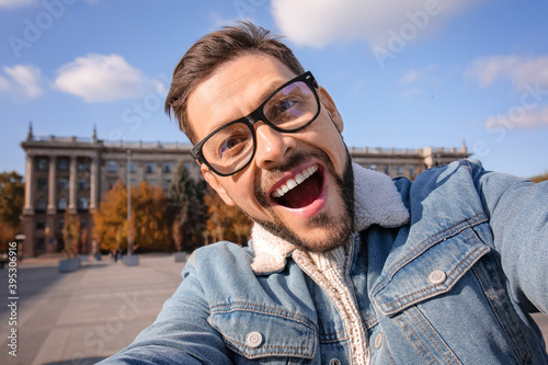 Handsome man taking selfie ...