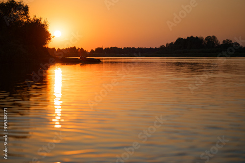 colorful beautiful red sunset over the river