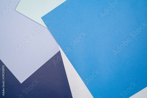 Abstract paper background with blue and cerulean colors .