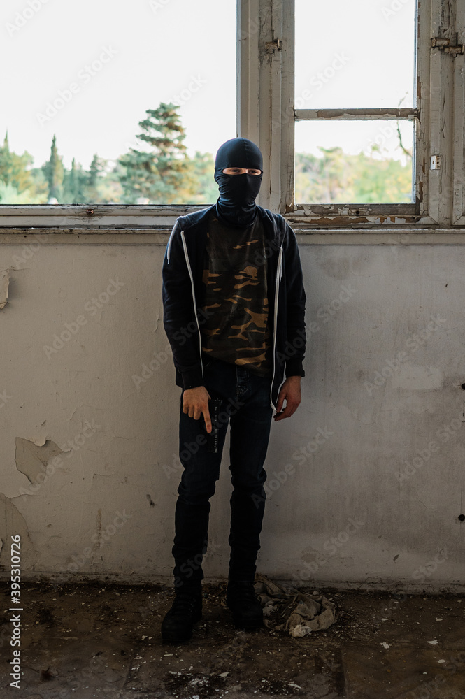 Man reenacting special unit of Croatian military police. Wearing green jumpsuit with black add-ons and assault rifle G36. Man reenacting special unit of Croatian military police. Wearing green jumpsuit with black add-ons and assault rifle G36.