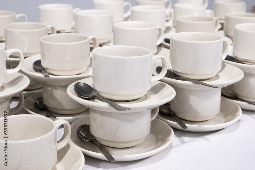 catering, many small white cups with spoons catering, many small white cups with spoons