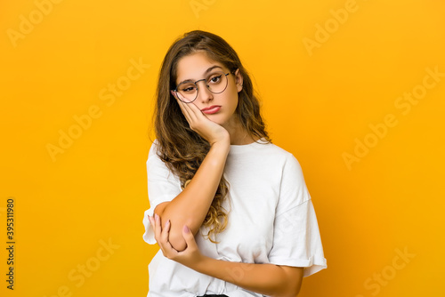 Schilderij op canvas Young caucasian woman who is bored, fatigued and need a relax day