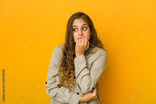 Young caucasian woman biting fingernails, nervous and very anxious. © Asier