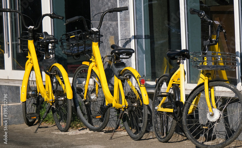 The yellow bike in sharing project. bicycles of the urban bike-sharing to move into ecologically city. 