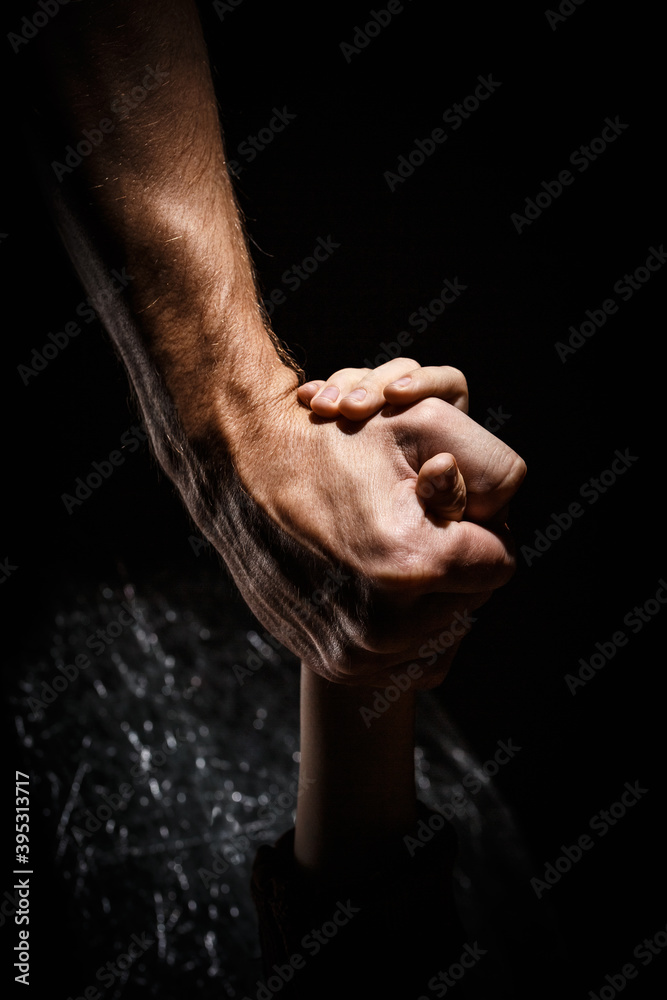 Fototapeta premium The child holds his father hand.