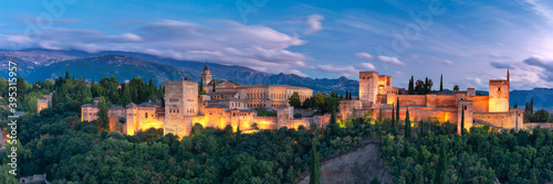 Palace and fortress complex Alhambra with Comares Tower, Palacios Nazaries and Palace of Charles V during sunset in Granada, Andalusia, Spain © Kavalenkava