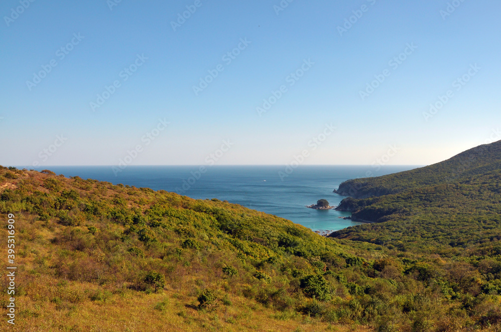 Sea of Japan, green islands in the haze, Far East, Vladivostok, Russia. Panoramic view from above.
