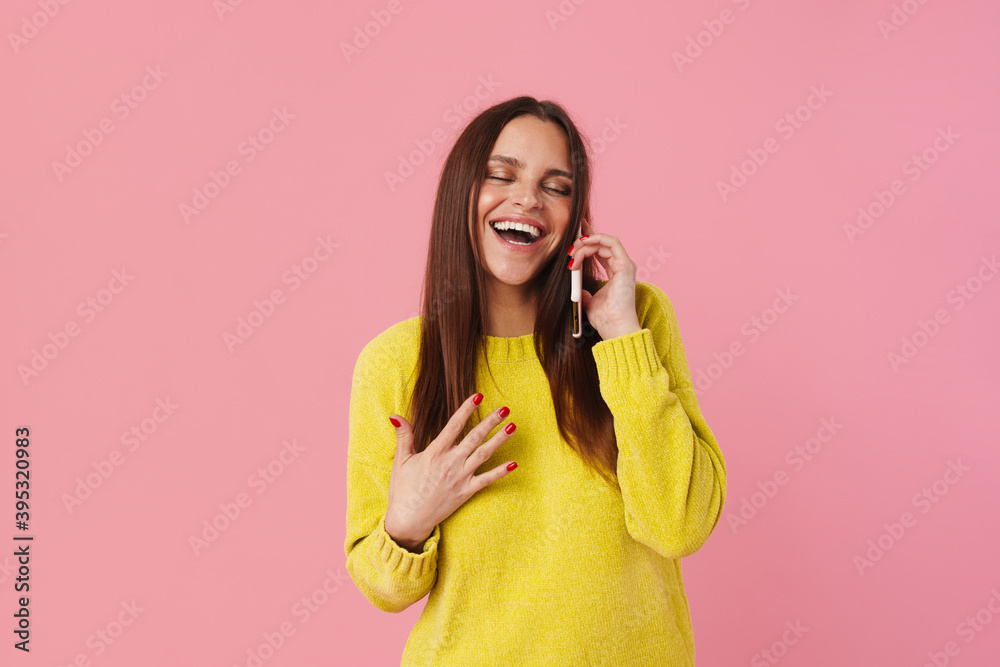 Joyful brunette girl laughing while talking on cellphone Joyful brunette girl laughing while talking on cellphone