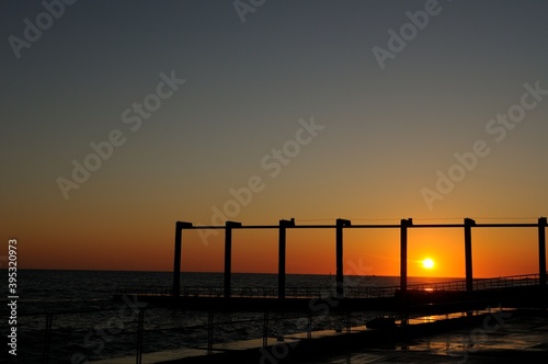 Sunset on the pier in Sochi. A wonderful summer in Sochi. Create brilliant vibrant colors. © алексей синяков