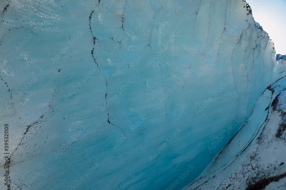 Glacier close up. Blue ice in mountains. Ice cold texture