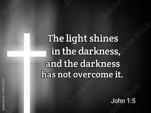 Inspirational bible verse about light and darkness with white jesus cross symbol on black and white background