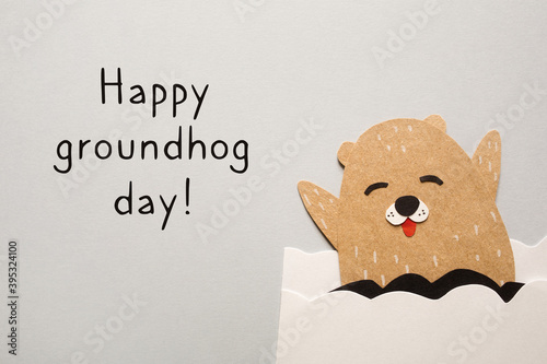 happy groundhog day. paper craft for kids on gray background. create art for children. photo