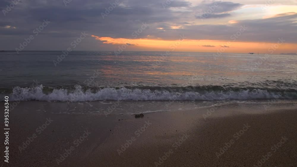 Slow motion waves land on beautiful sunset beach, Thailand Slow motion waves land on beautiful sunset beach, Thailand