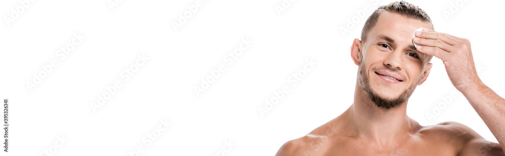 Obraz premium sexy shirtless man using cotton pad isolated on white, banner