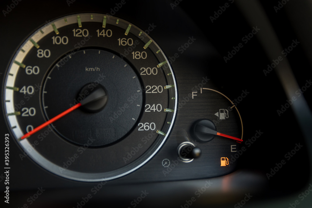 Empty fuel warning light in car dashboard. Fuel pump icon. gasoline gauge dash board in car with digital warning sign of run out of fuel turn on. Low level of fuel show on speedometer dashboard. Empty fuel warning light in car dashboard. Fuel pump icon. gasoline gauge dash board in car with digital warning sign of run out of fuel turn on. Low level of fuel show on speedometer dashboard.