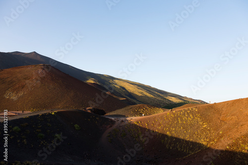 Sicily, Italy. Tourists make the steep climb up the Silvestri Superiori crater near the summit of Mt Etna.