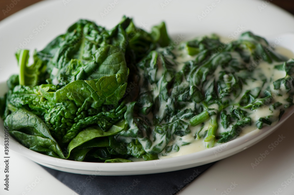 Creamed spinach roasted in garlic, onions, olive oil and fresh herbs and spices. Classic American steakhouse or French bistro appetizer or side dish. Creamed spinach roasted in garlic, onions, olive oil and fresh herbs and spices. Classic American steakhouse or French bistro appetizer or side dish.