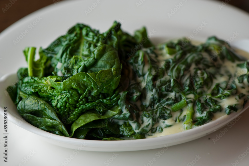 Creamed spinach roasted in garlic, onions, olive oil and fresh herbs and spices. Classic American steakhouse or French bistro appetizer or side dish. Creamed spinach roasted in garlic, onions, olive oil and fresh herbs and spices. Classic American steakhouse or French bistro appetizer or side dish.