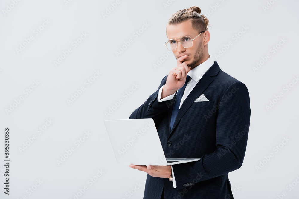 young businessman in suit and glasses with laptop isolated on white young businessman in suit and glasses with laptop isolated on white