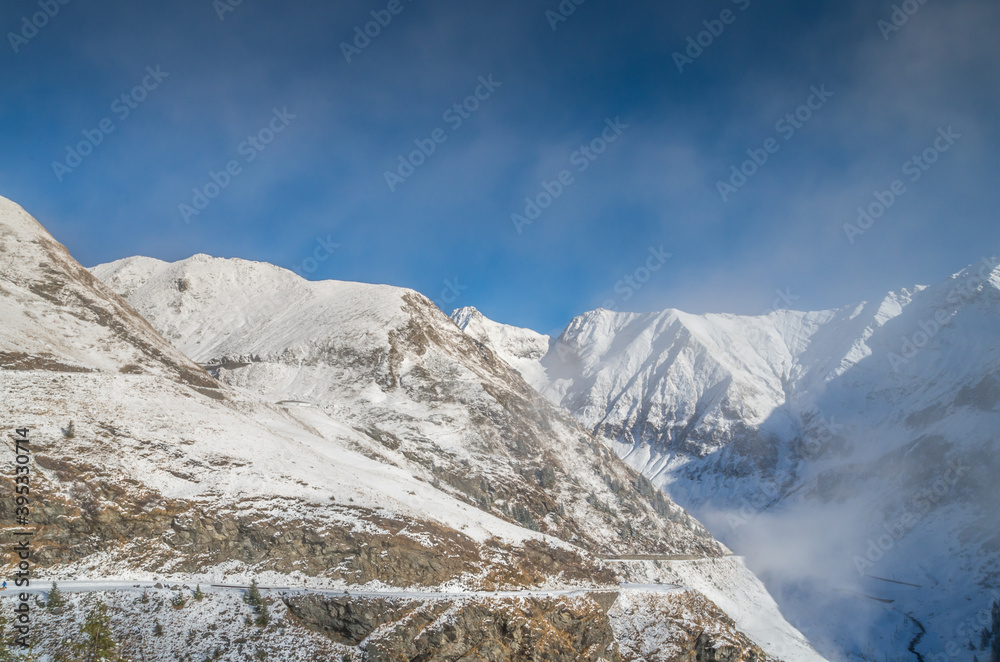 Stunning view of Fagaras mountains in winter. The ridge of the mountain full of snow. There are one of the beautiful road in the world, Transfagarasan