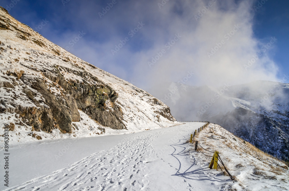 Stunning view of Fagaras mountains in winter. The ridge of the mountain full of snow. There are one of the beautiful road in the world, Transfagarasan Stunning view of Fagaras mountains in winter. The ridge of the mountain full of snow. There are one of the beautiful road in the world, Transfagarasan