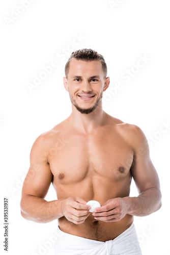  sexy shirtless man in towel with cotton pad isolated on white