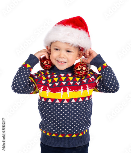 little boy with Santa`s hat