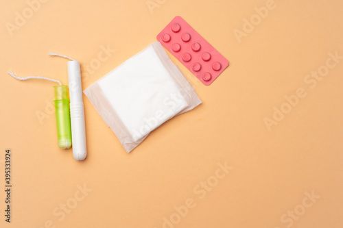 Flat lay of Pads  tampons and pills