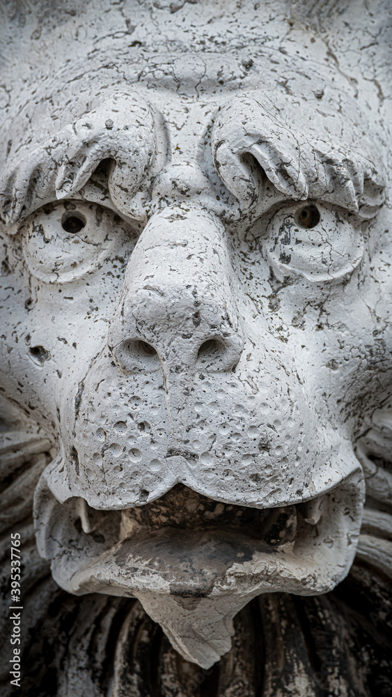 Ancient decoration element of scary lion head at roof of Basilica San Marco and Doge Palace in Venice, Italy Ancient decoration element of scary lion head at roof of Basilica San Marco and Doge Palace in Venice, Italy