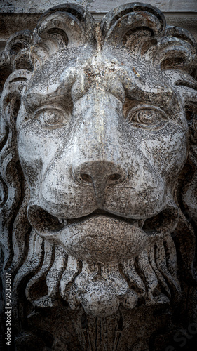 Ancient decoration element of scary lion head at roof of Basilica San Marco and Doge Palace in Venice, Italy