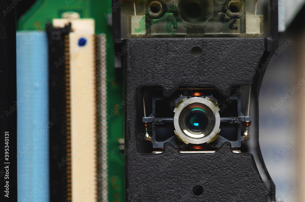 Close-up of a laser lens for reading and writing dvd roma cd drive. Readout optical design