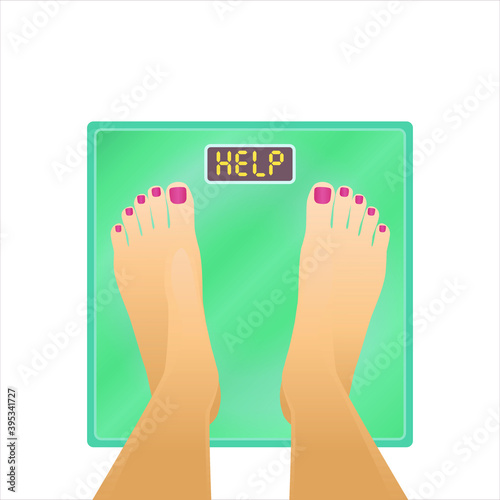 Feet on bathroom scale with word "Help" on dial. Weight problems concept with woman feet on scale 