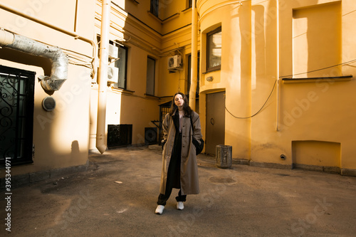 Girl posing in the yard in Saint-Petersburg.