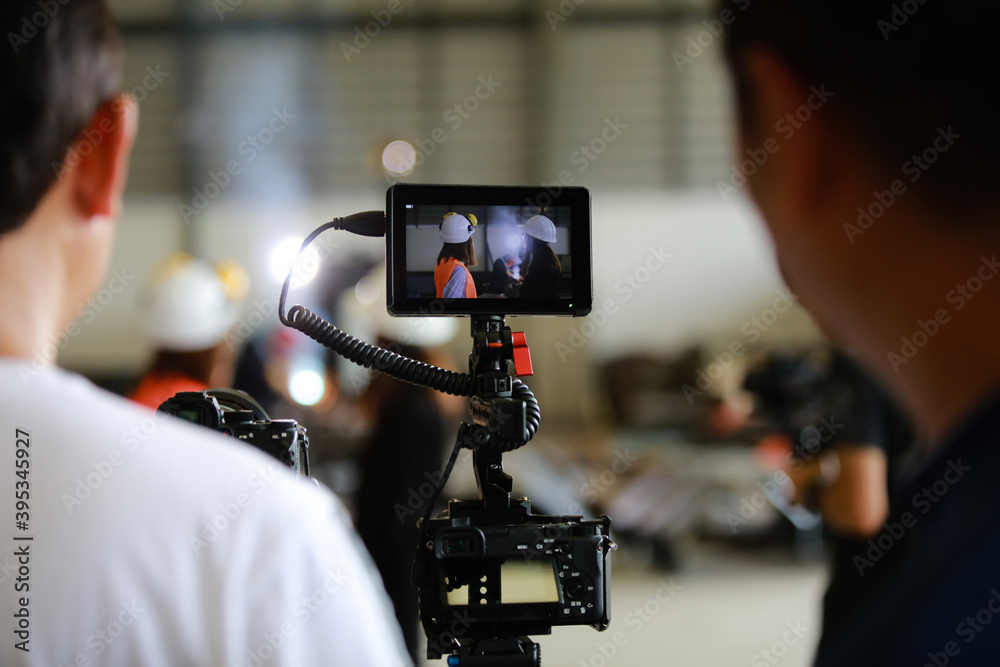 Media team shoot video in manufacturing , photographer shooting video the engineer in factory Media team shoot video in manufacturing , photographer shooting video the engineer in factory