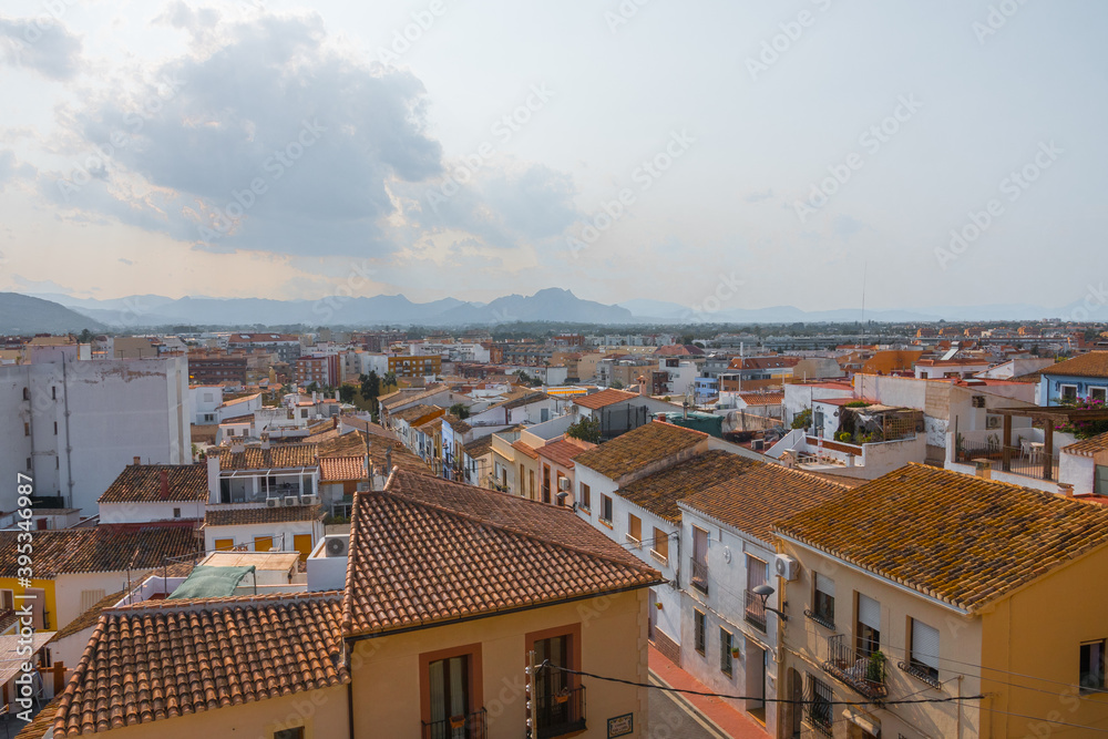 Beautiful cityscape of Denia. Aerial view from the historic moorish castle in the old town holding the Palau del Governador. Costa Blanca, Alicante province, Valencian Community, Spain.