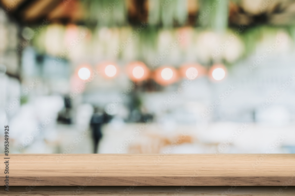 Empty wood table and blurred light table in coffee shop and cafe with bokeh background. product display template.