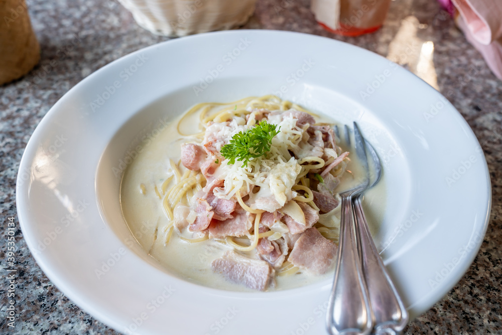 Spaghetti carbonara with bacon and fresh parsley Spaghetti carbonara with bacon and fresh parsley