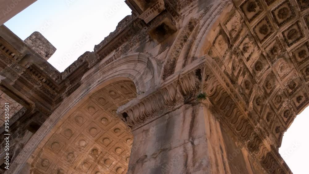View of Hadrians gate in old city of Antalya, Turkey. An ancient roman architecture background. View of Hadrians gate in old city of Antalya, Turkey. An ancient roman architecture background.