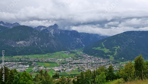 Beautiful panorama view of town Lienz, Tyrol, Austria, a popular tourist destination, located in valley at rivers Isel and Drau with snow-capped mountains of the rugged Gailtal Alps (Lienz dolomites).