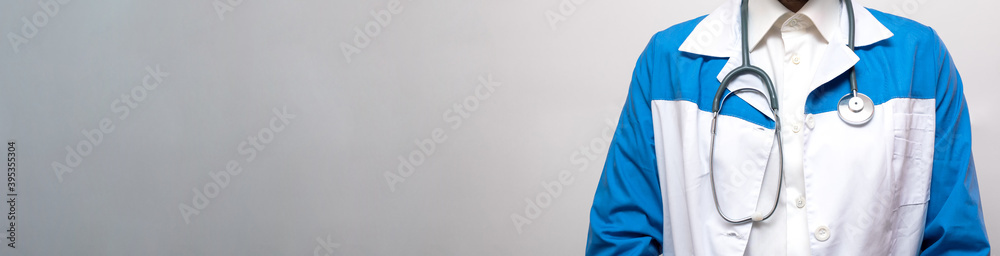 Man in a medical coat. Doctor concept. Banner. Copy space. Place for text. Man in a medical coat. Doctor concept. Banner. Copy space. Place for text.