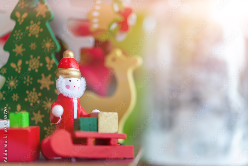 Santa Claus dolls and Christmas decorations box on abstract light background with copy space Santa Claus dolls and Christmas decorations box on abstract light background with copy space