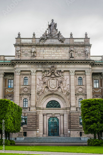 Neoclassical style of Sweden Parliament Building (Sveriges Riksdag) at Helgeandsholmen Island in the Gamla stan (Old Town) district of central Stockholm. Sweden. photo