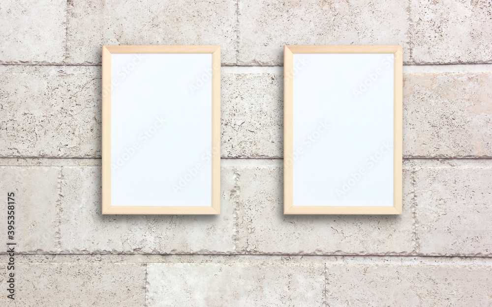 two empty rectangular frames on a wall. two empty rectangular frames on a wall.