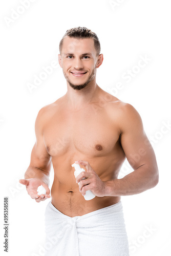  shirtless man with foam on face isolated on white