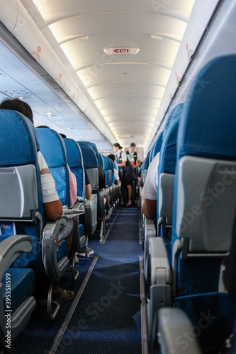 airplane interior with stewardess