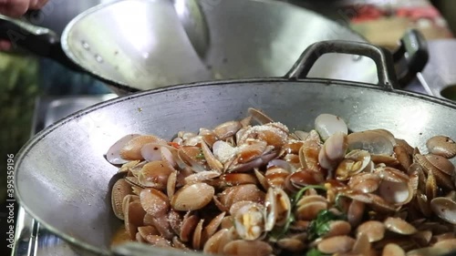 Thai food menu frying shell with herb an spict on hot pan photo