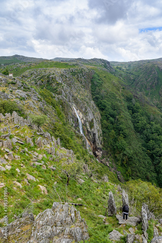 Giant waterfall in the background and tree in the foreground. Frecha da Mizarela photo